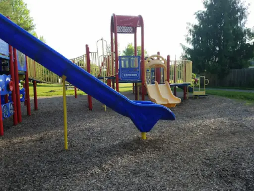 Children’s playground with slides and climbing areas, showing a safe and fun place for kids to play outdoors.