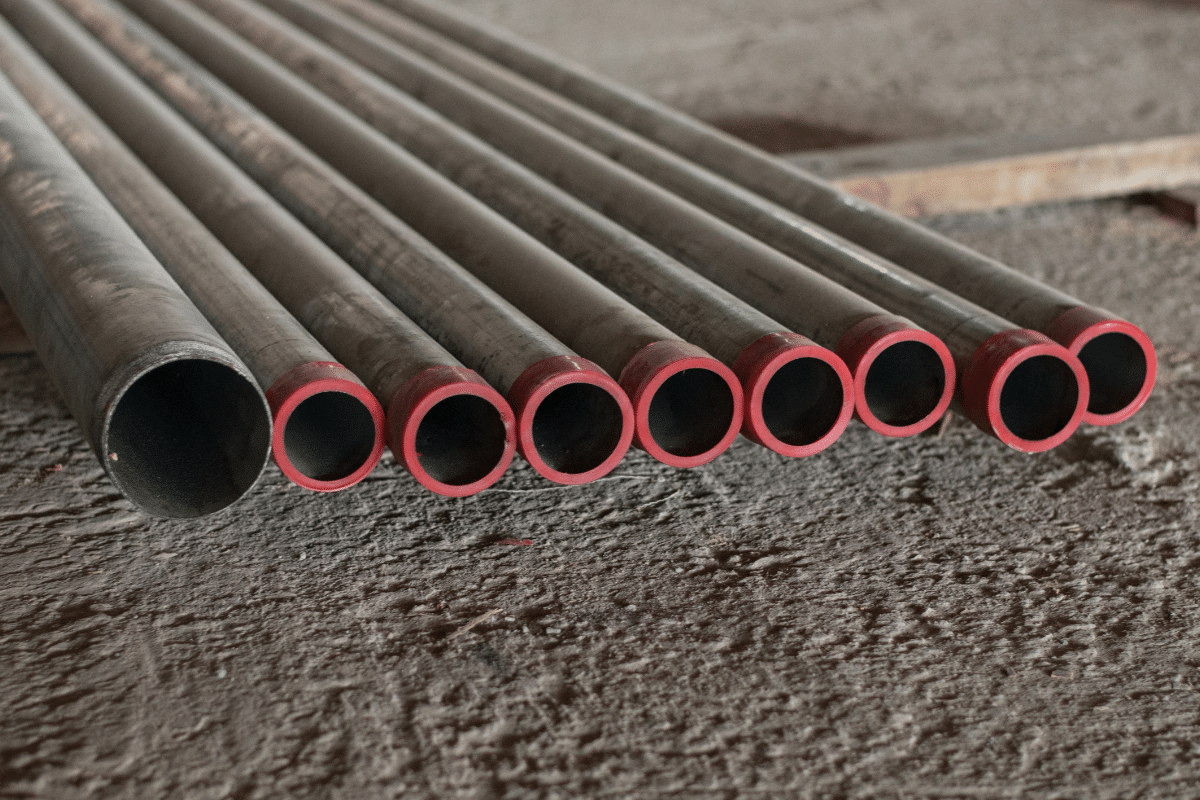 Titan Plumbing & Drains shows new pipes ready for use in local plumbing projects.